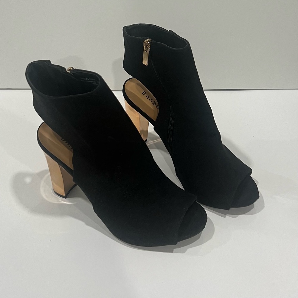 Black and gold heels